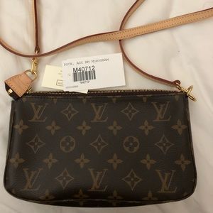 Louis Vuitton poch with long cross body strap.